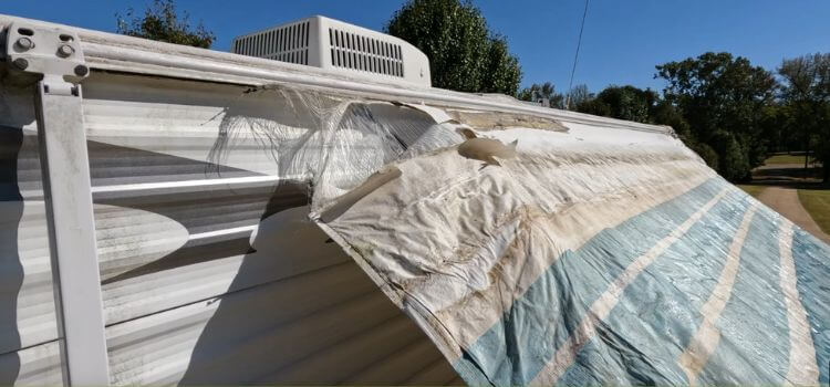 Remove the old fabric from the RV awning. 